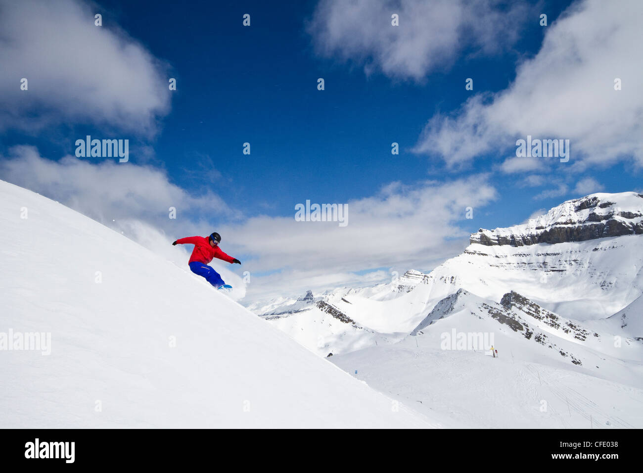 Young man snowboarding at Lake Louise Resort, Banff National Park