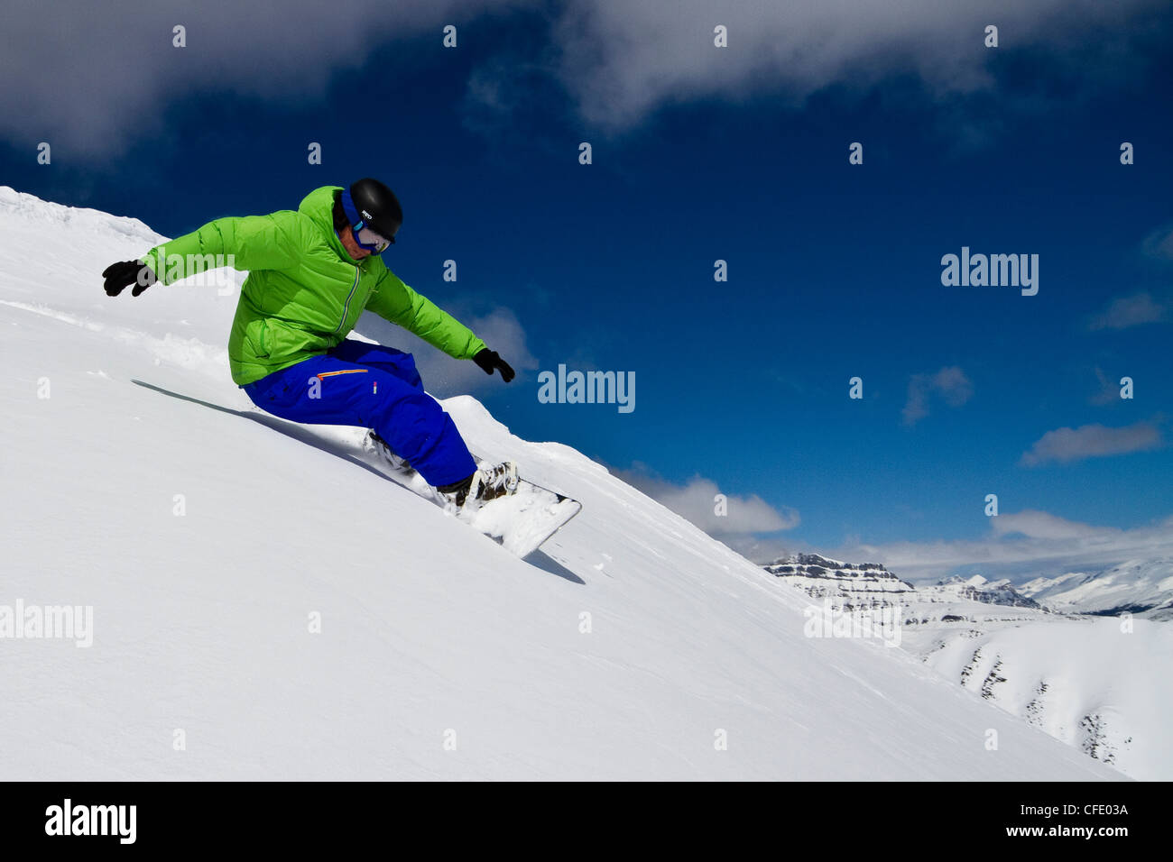 Young man snowboarding at Lake Louise Resort, Banff National Park