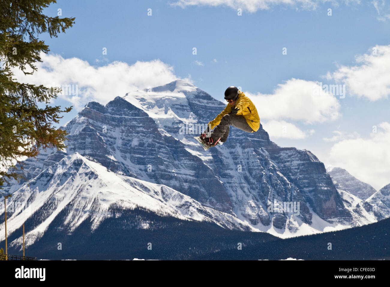 Young man snowboarding at Lake Louise Resort, Banff National Park