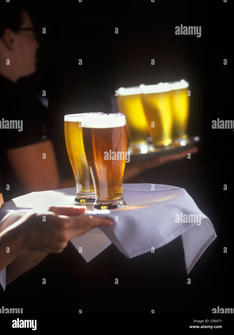 Servers serving beer at Canoe Club brewpub in Victoria, British Columbia, Canada Stock Photo