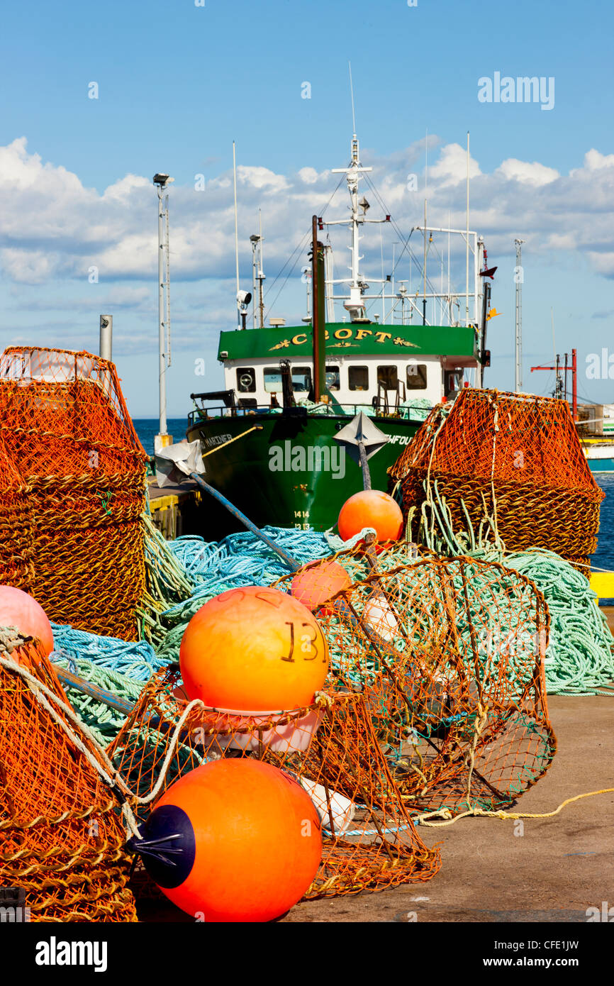 Fishing boat, traps, nets and buoys on southside of St. John's Harbour, Newfoundland, Canada Stock Photo
