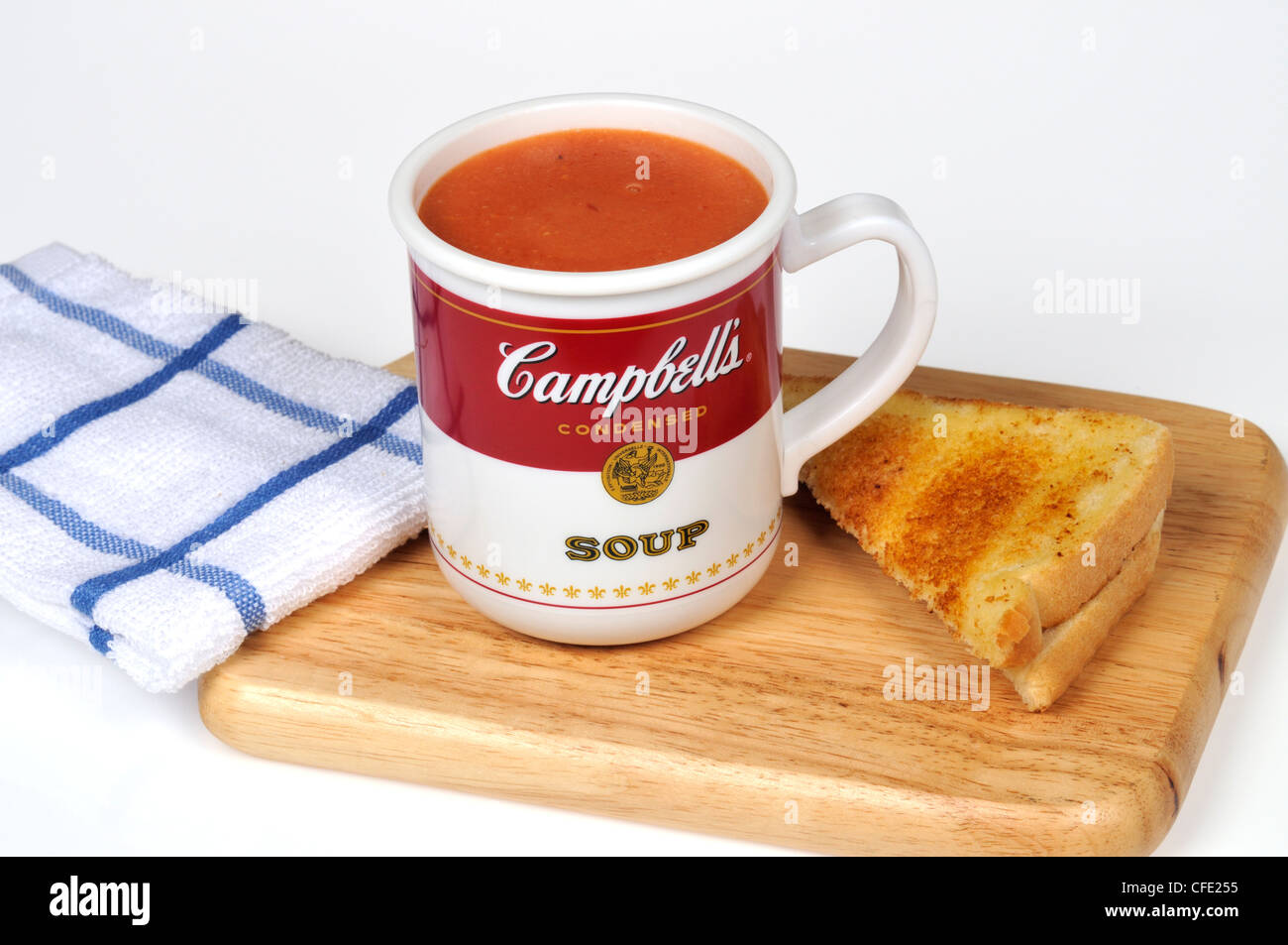 Campbells cup of tomato soup on deli board with toast Stock Photo Alamy