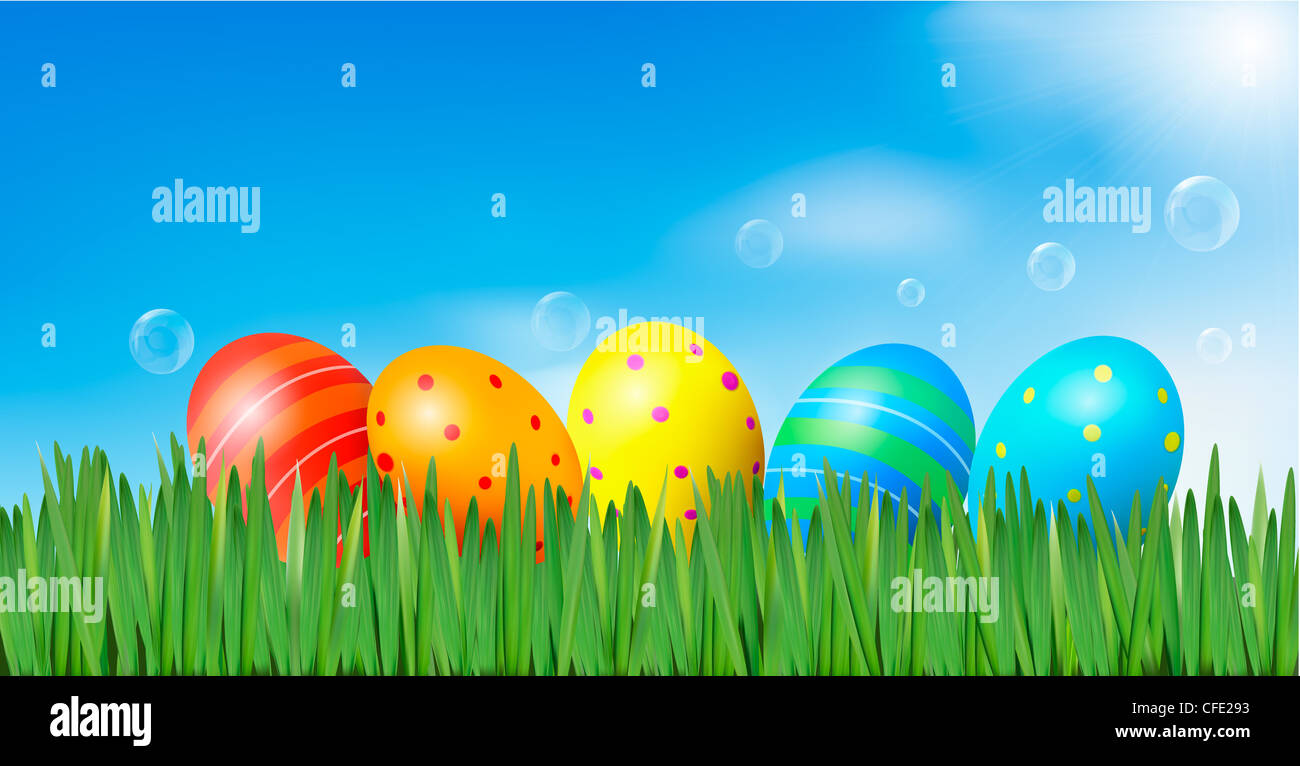 Easter eggs in the grass with daisies Stock Photo - Alamy