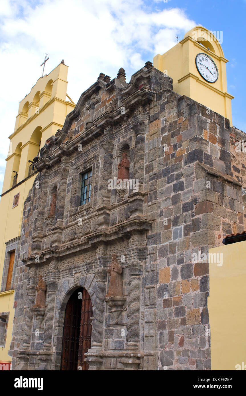 Facade and front entrance of Franciscan Monastery in Amacueca Mexico showing entrance and clock Stock Photo