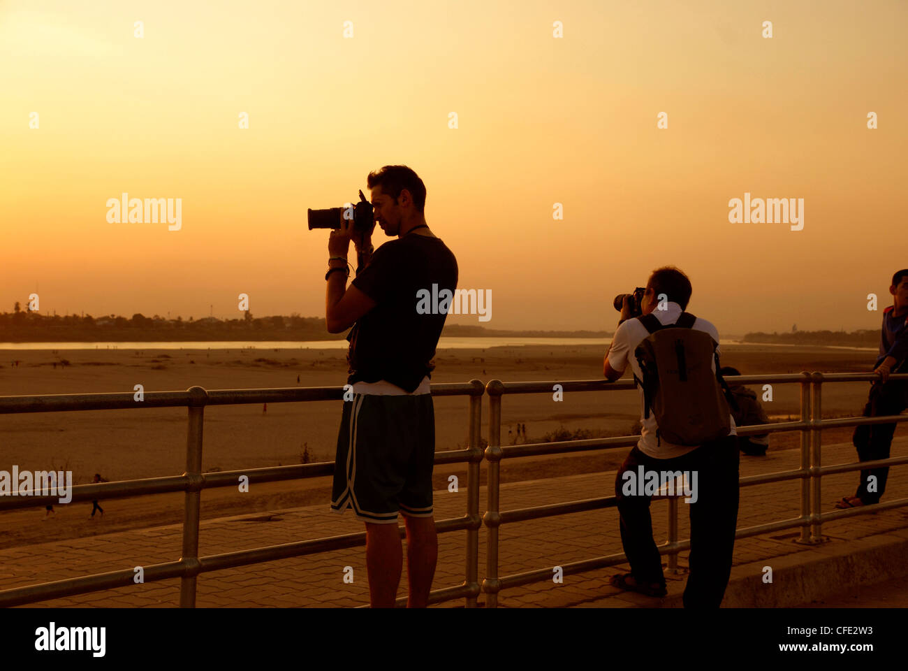 keen photographers capturing the sunset in Vientiane Laos taken on 24/01/2012 Stock Photo