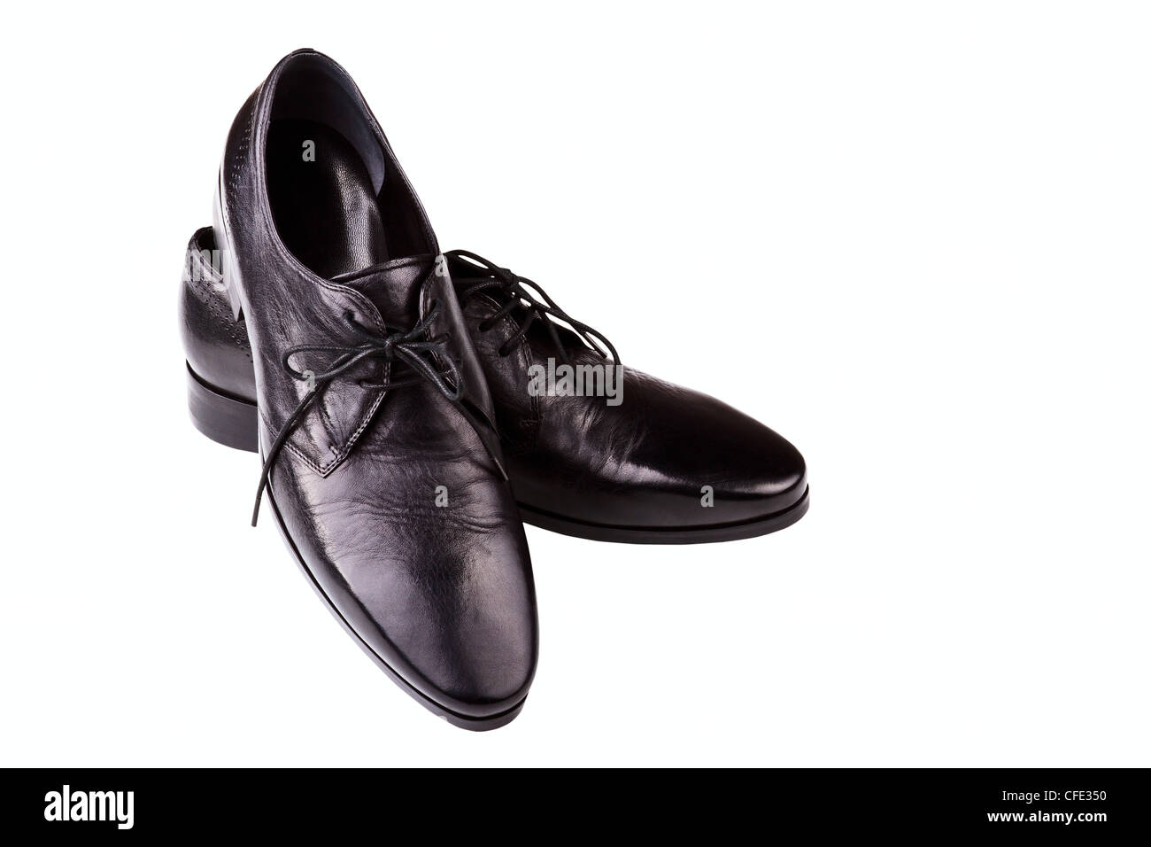 Black leather man's shoes on a white background Stock Photo - Alamy