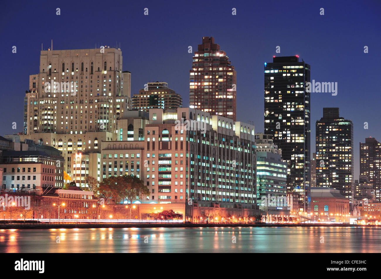 New York City Manhattan midtown skyline at night over East River Stock ...