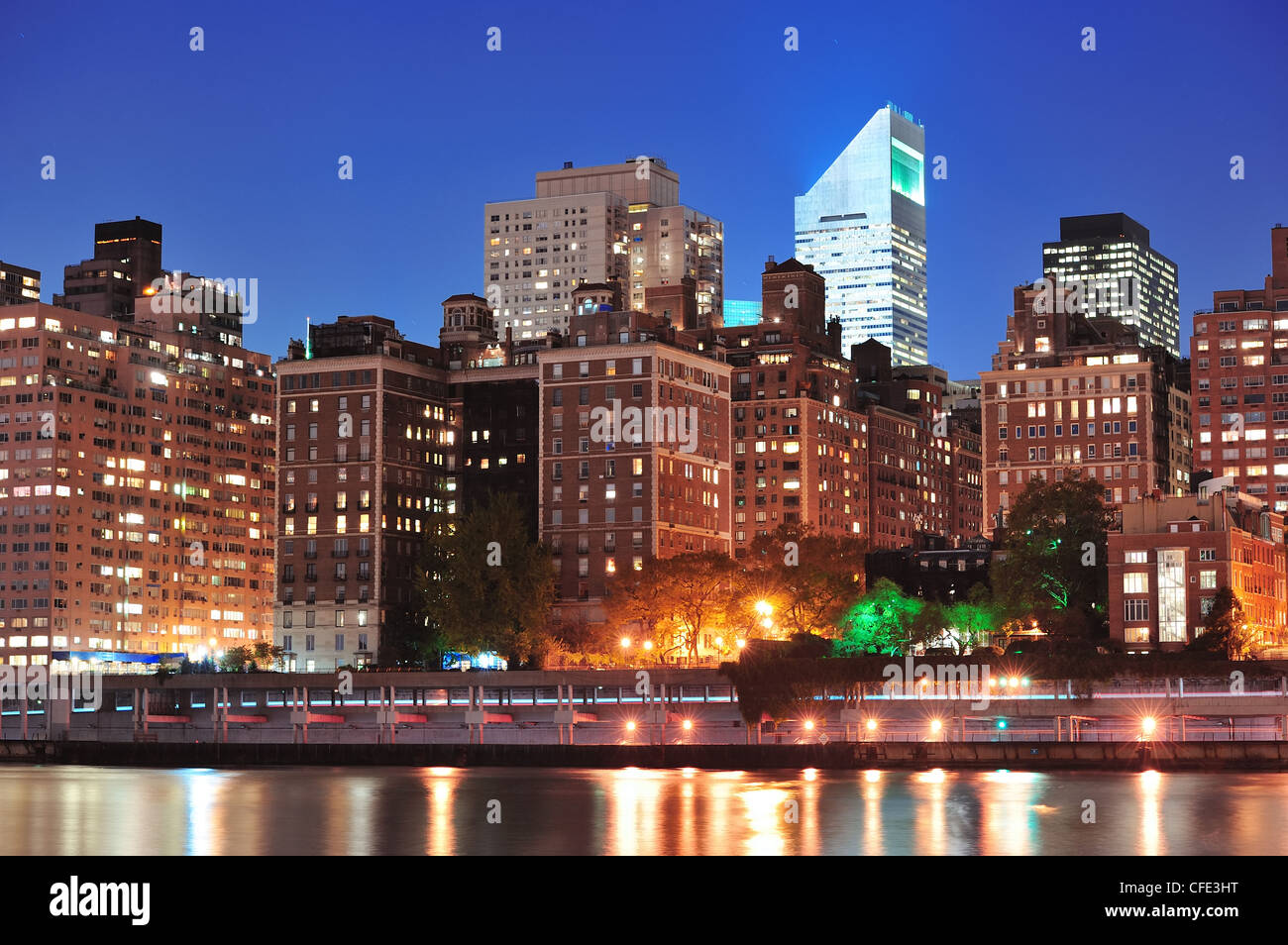 New York City Manhattan midtown skyline at night over East River Stock ...
