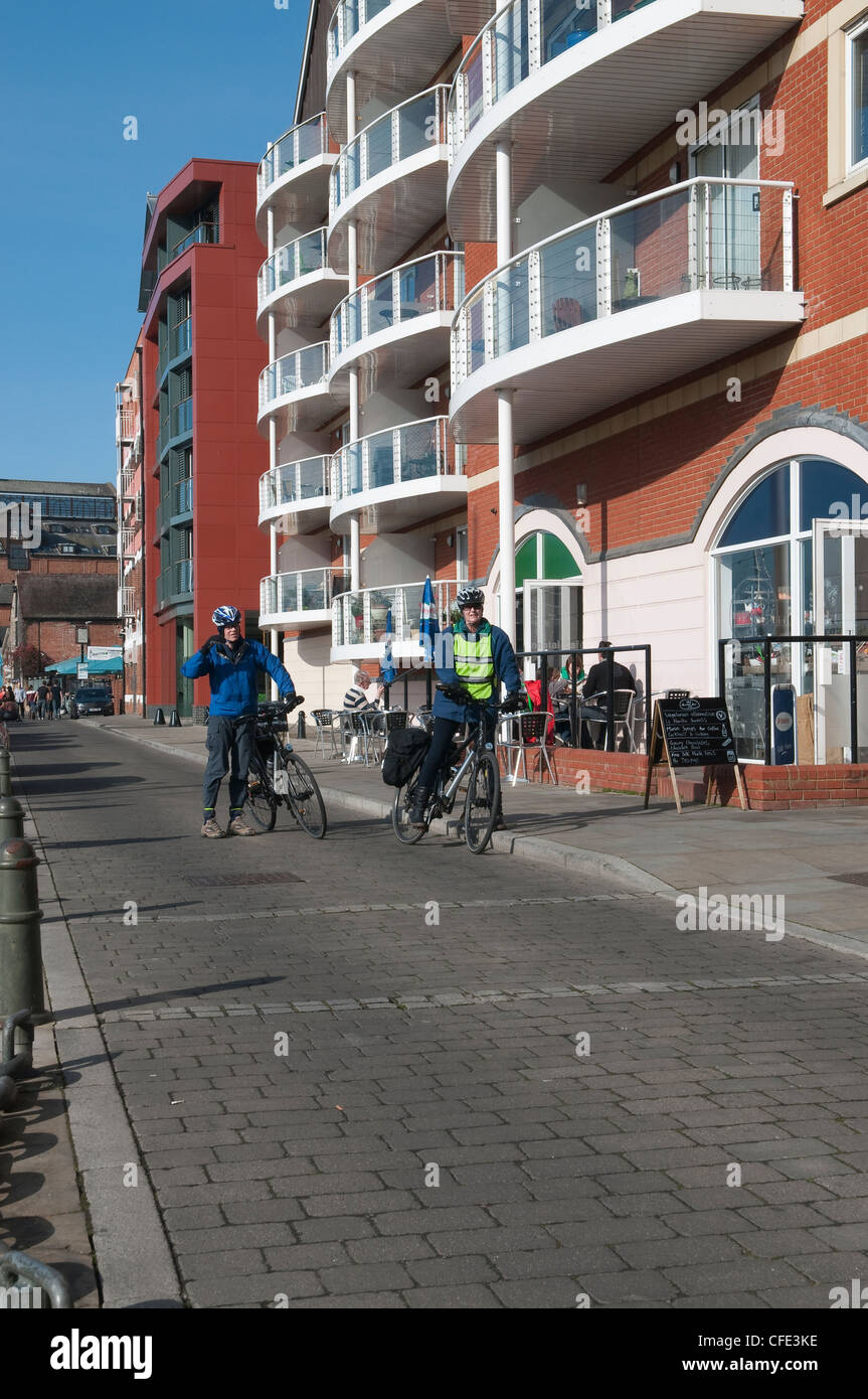 Cyclists at the front of waterfront coffee shop in Ipswich Suffolk UK Stock Photo