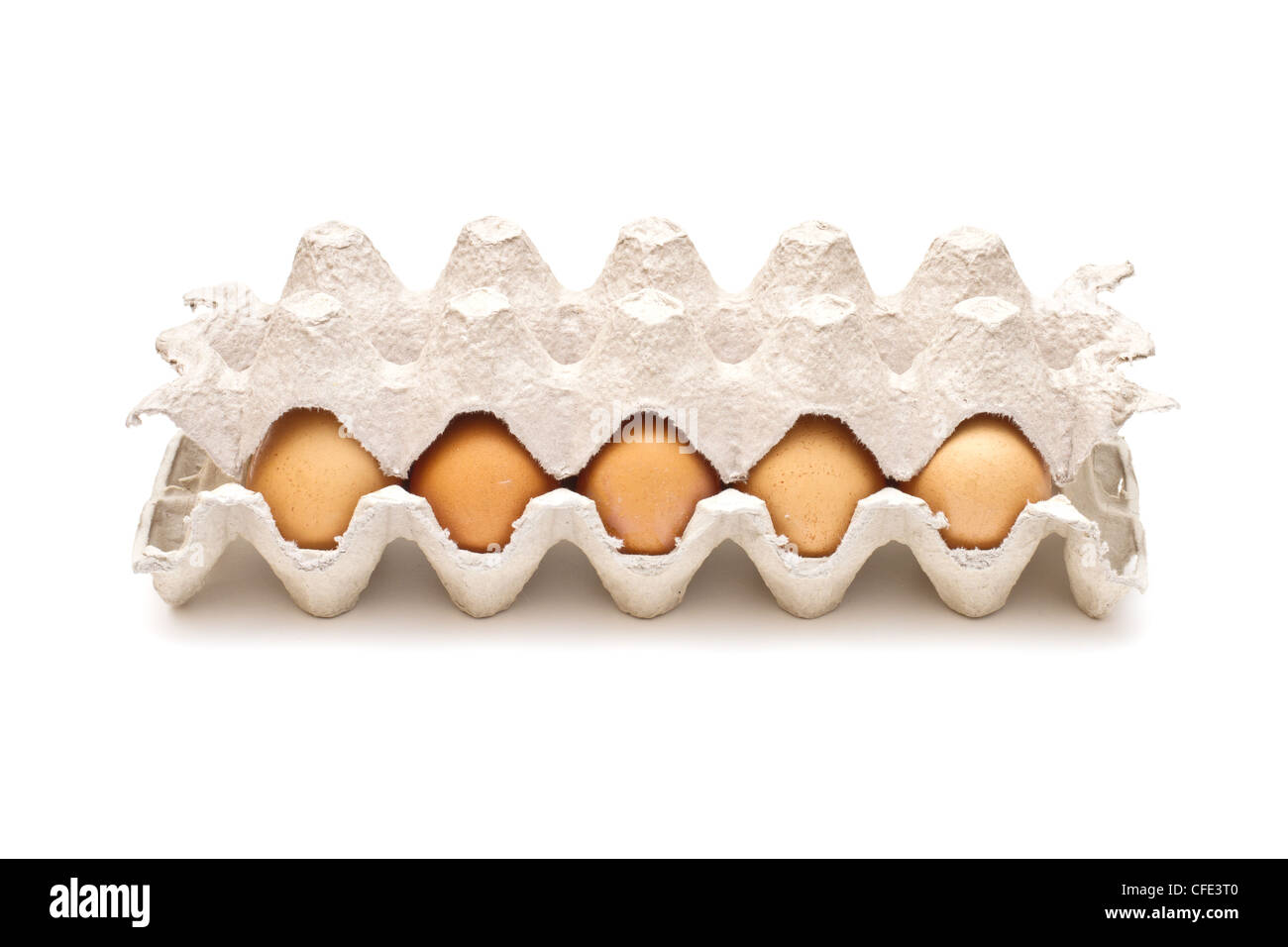 Brown eggs in a carton package on white background Stock Photo