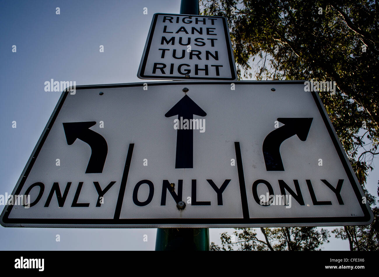 Road sign right lane must turn right. Stock Photo
