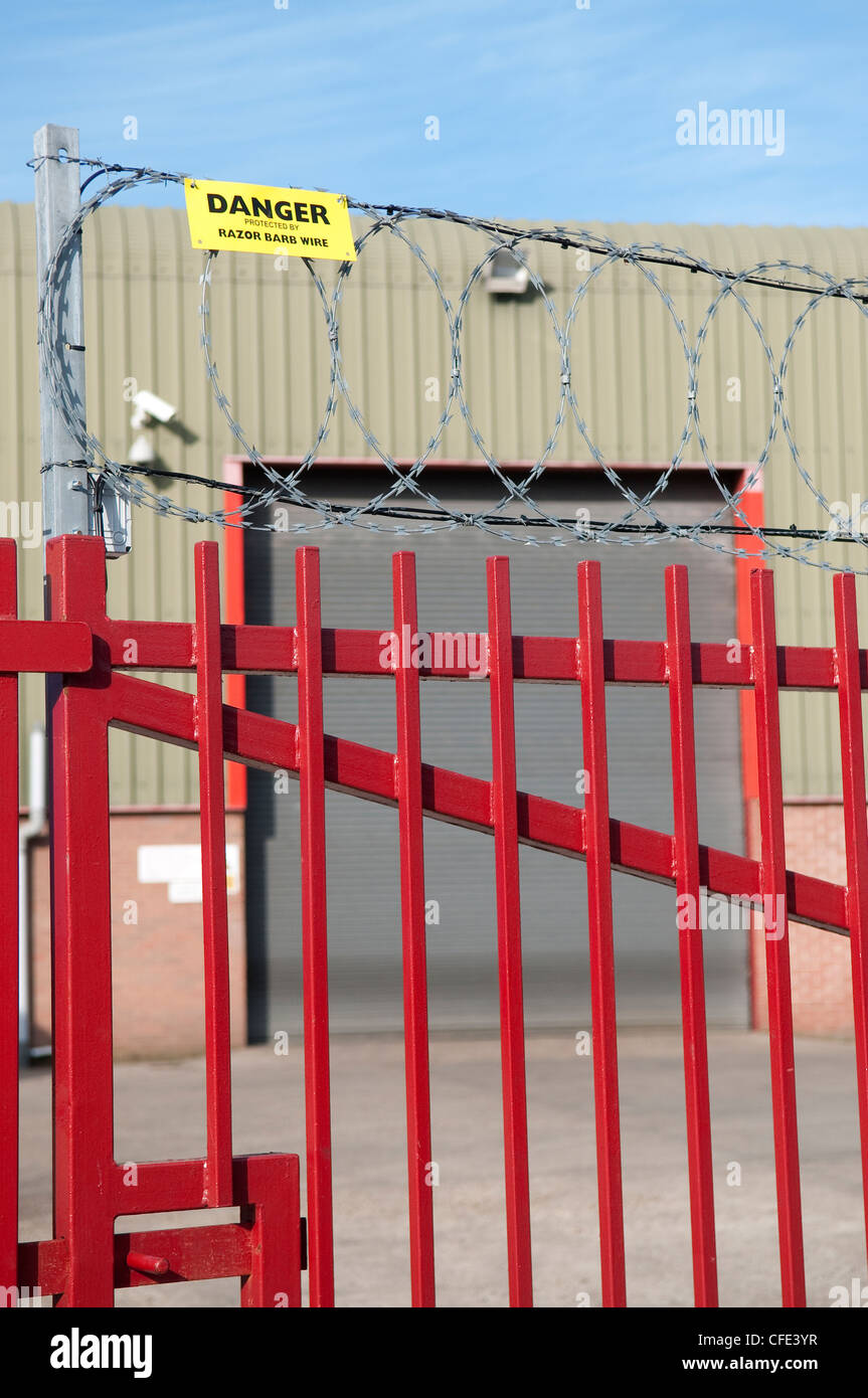 Barbed wire fence inside industrial area, Ipswich, Suffolk, UK Stock Photo
