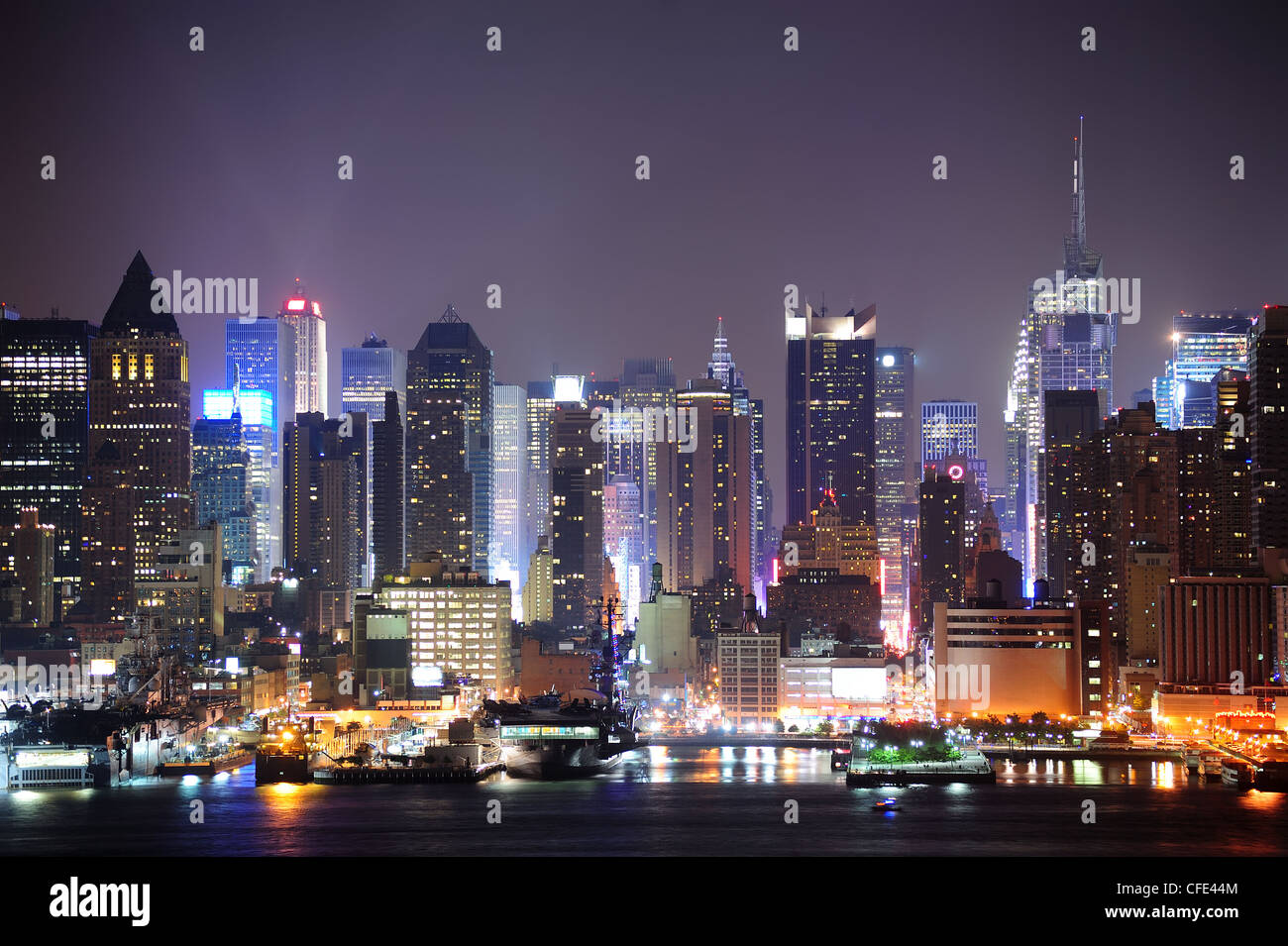 New York City Manhattan midtown skyline at night with skyscrapers lit ...