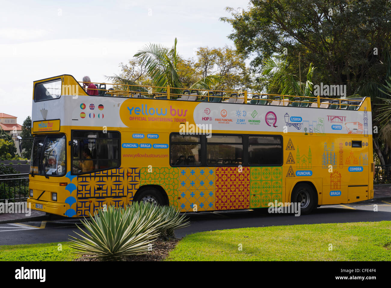 Yellow open top tourist bus Funchal Madeira Portugal Stock Photo