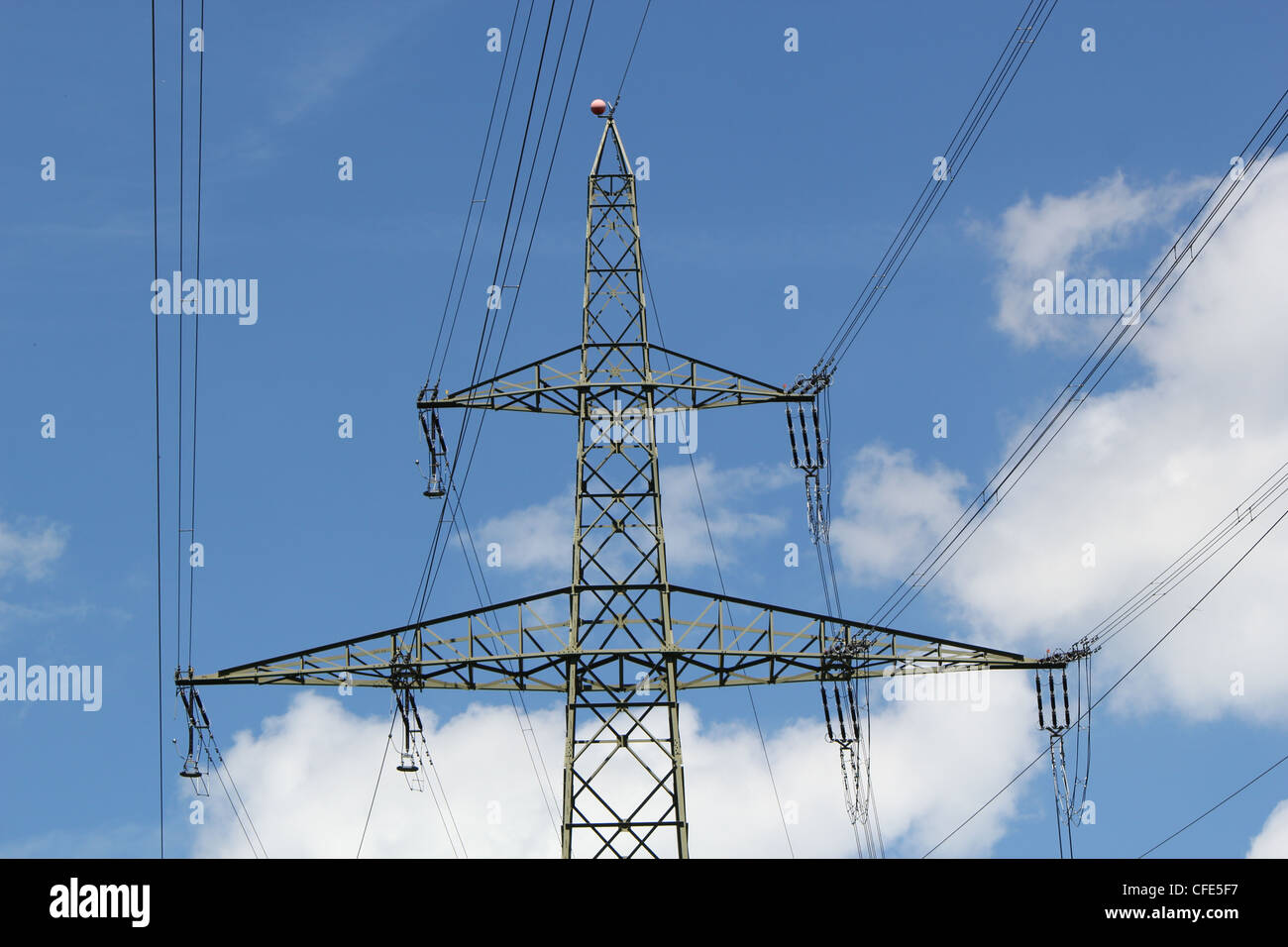Electrical pylon in a cloudy sky Stock Photo - Alamy