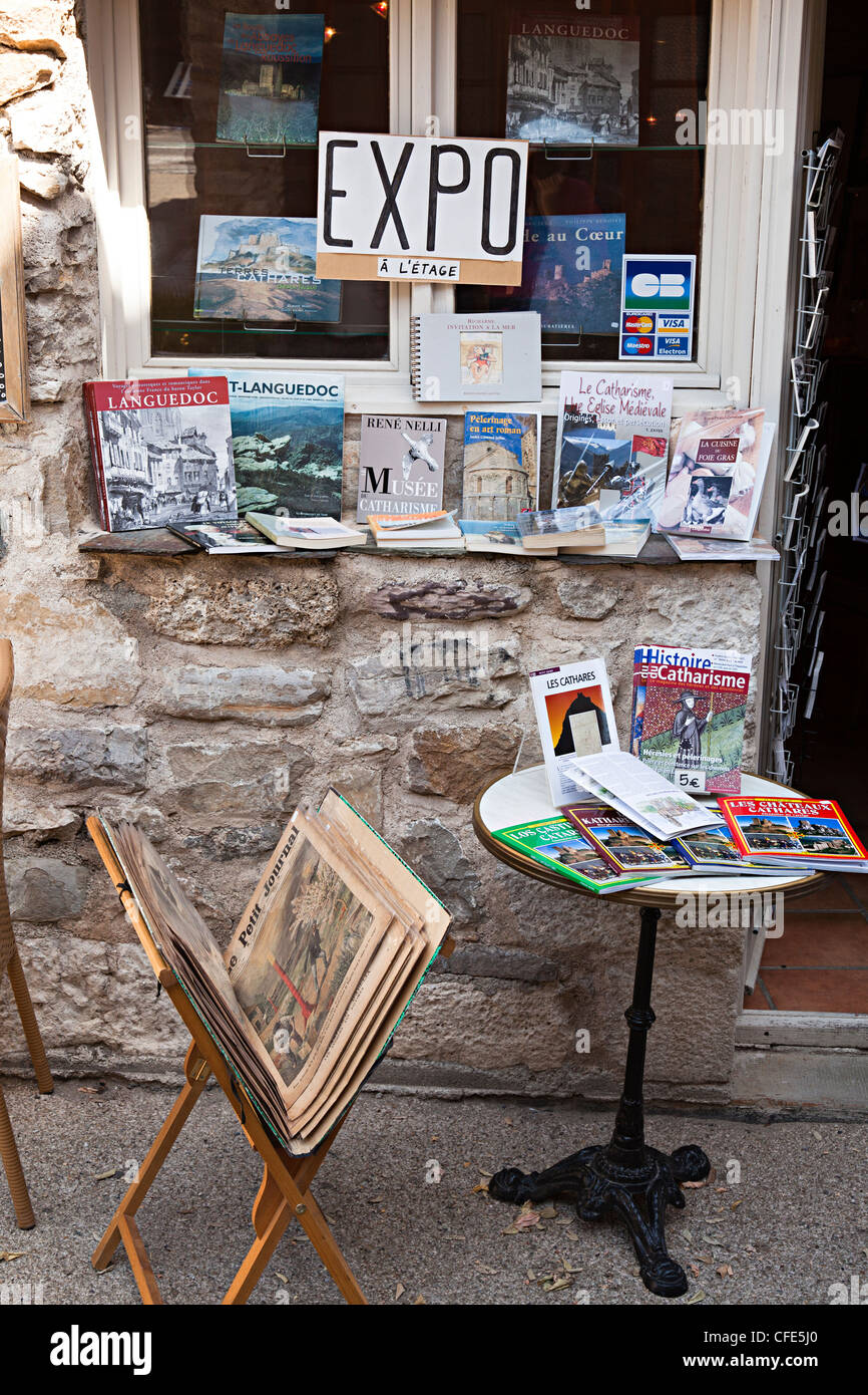Collectable books and magazines displayed outside a shop in Minerve, a Cathar Languedoc village, Herault, France Stock Photo