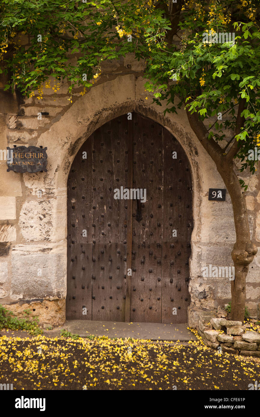 UK, Gloucestershire, Stroud, Painswick, Bisley Street, medieval arched entrance to The Chur, historic C16th house Stock Photo