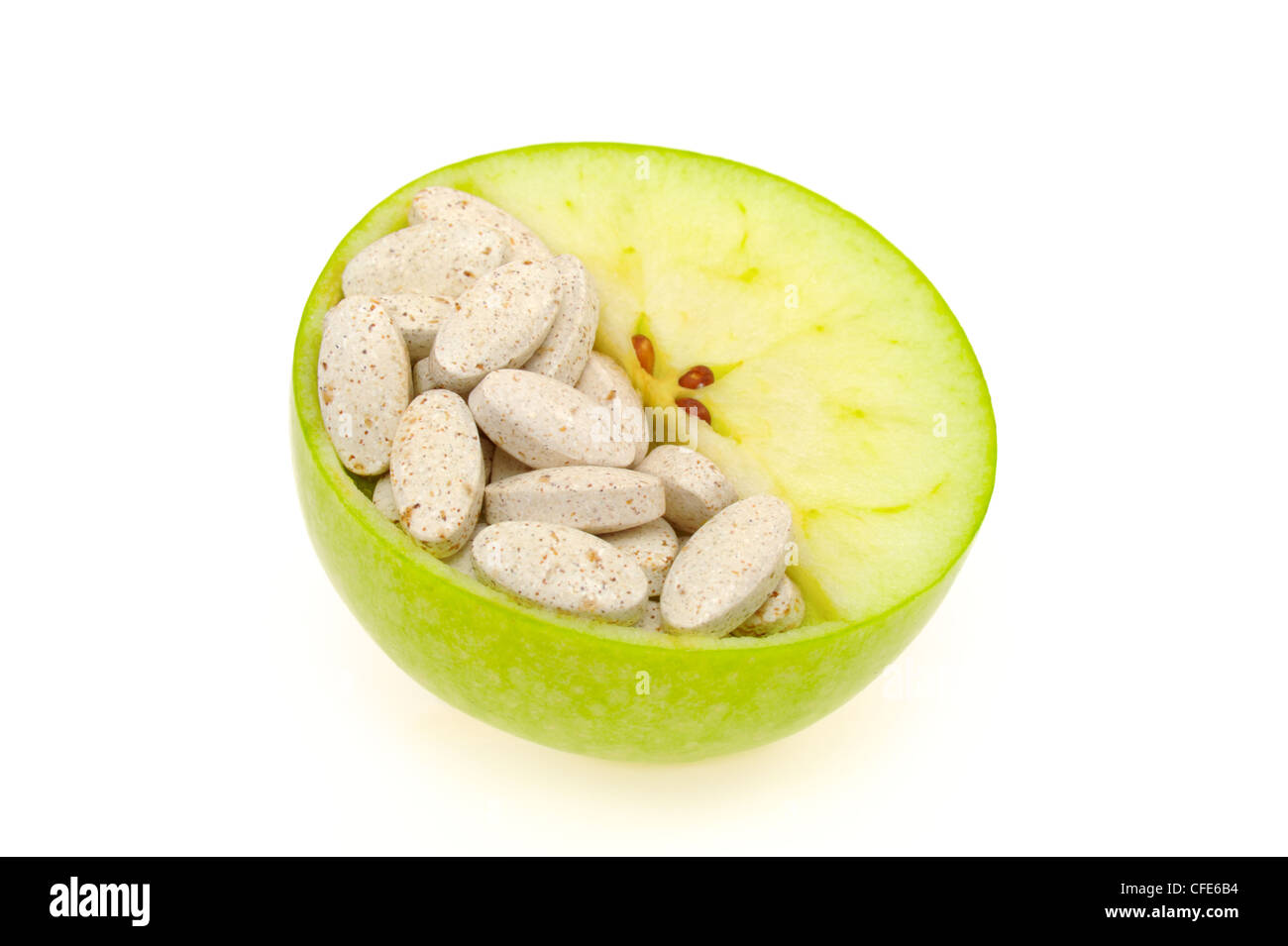Close up of fresh green apple and pills isolated vitamin