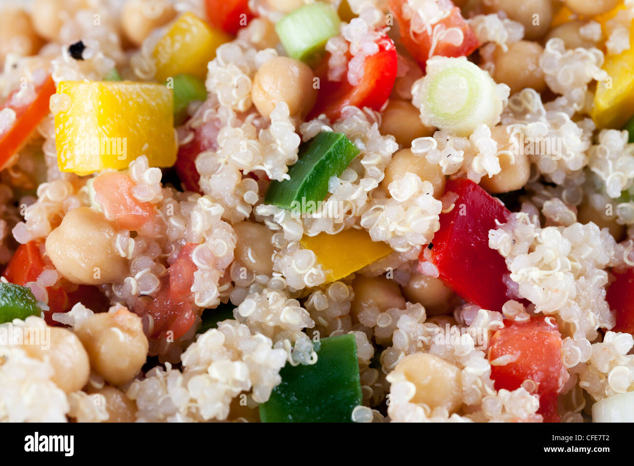 Close up of fresh quinoa salad with bell peppers and chickpeas. Stock Photo