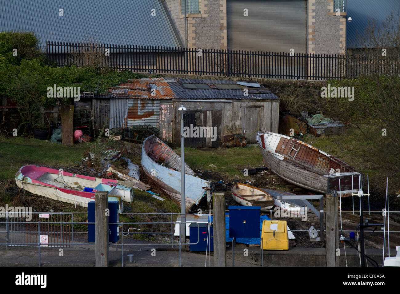 A boat graveyard in Oban on the west coast of Scotland Stock Photo