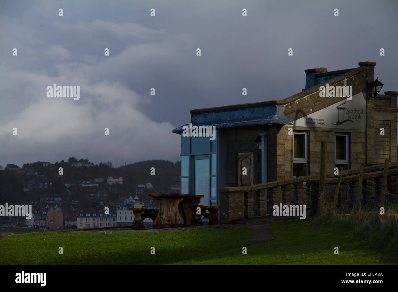 An exterior view of the Seafood Temple restaurant in Oban with the town in the background Stock Photo