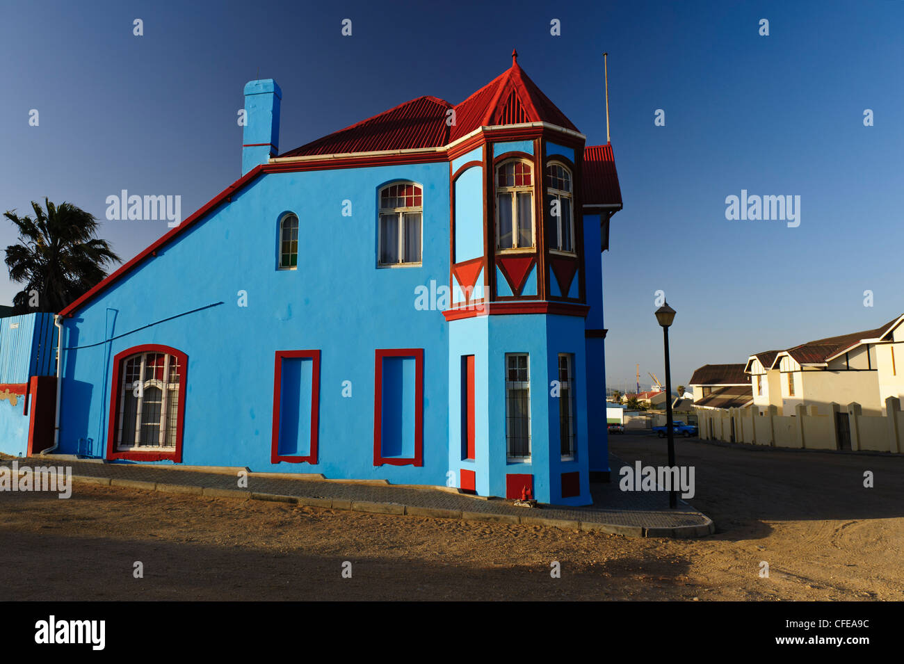 Bright blue colonial house at junction Ufer / Berg / Kirch Strasse. Luderitz, Namibia Stock