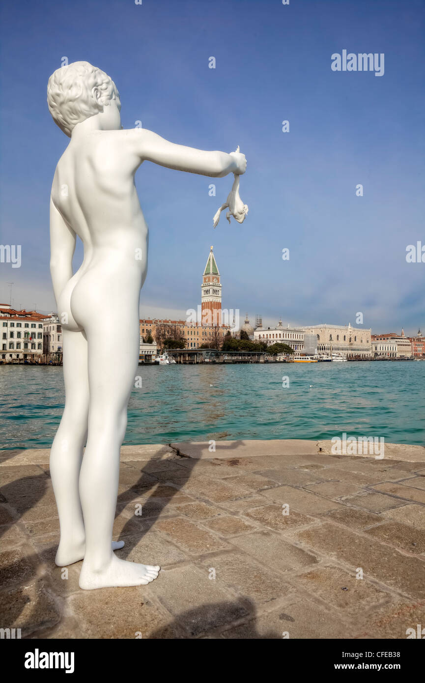 Boy with frog sculpture, Venice, Veneto, Italy Stock Photo
