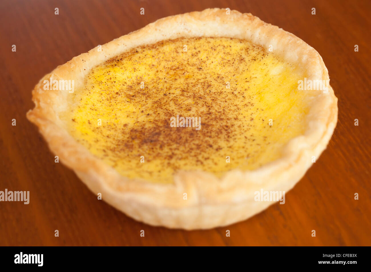 Custard tart on wood table background. Stock Photo