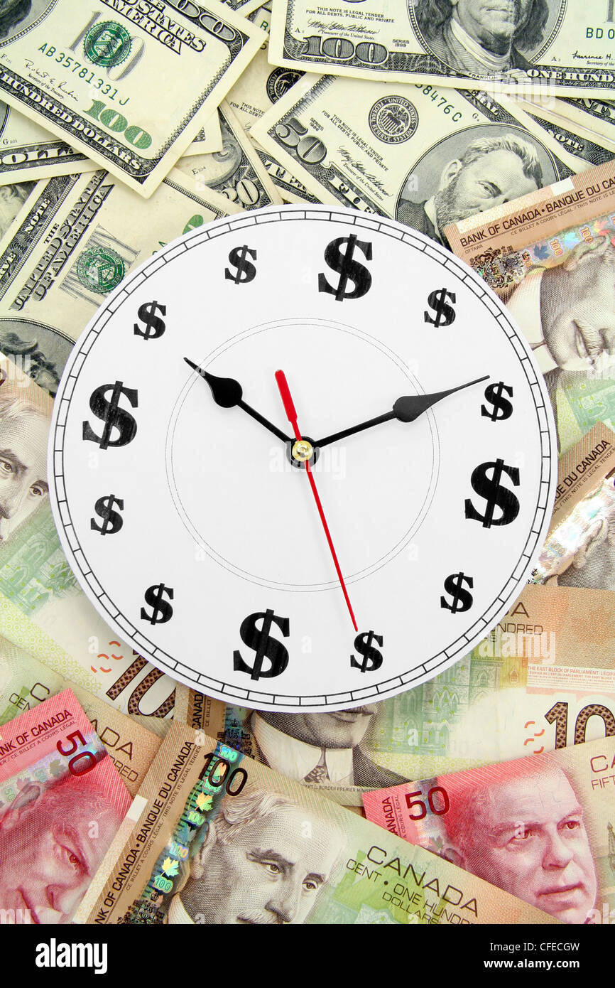 clock us and canadian dollars, concept of time is money Stock Photo - Alamy