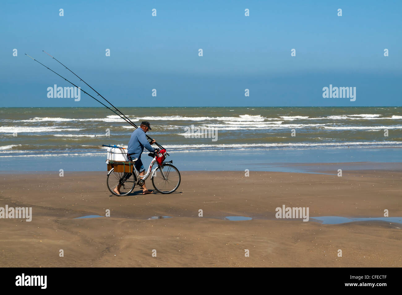 fisherman in a bicycle in  spanish Doñana national park Stock Photo
