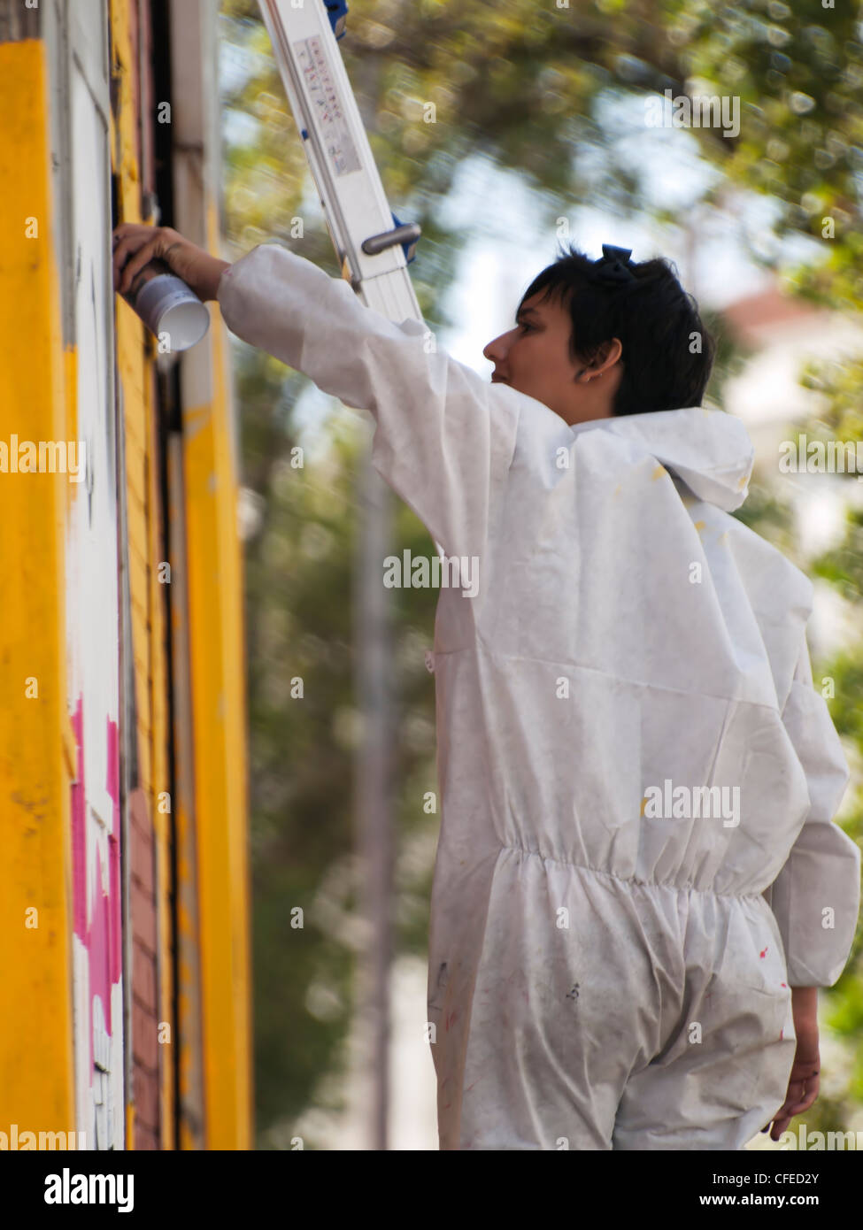 A girl painting a graffiti Stock Photo