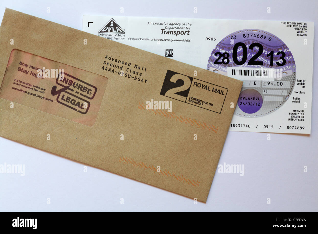 new car tax disc sent through post with envelope set on white