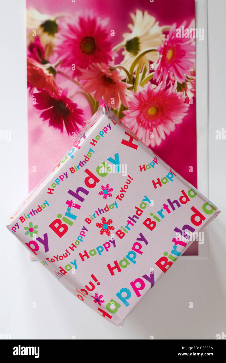 Happy Birthday wrapped present with birthday card set on white background Stock Photo