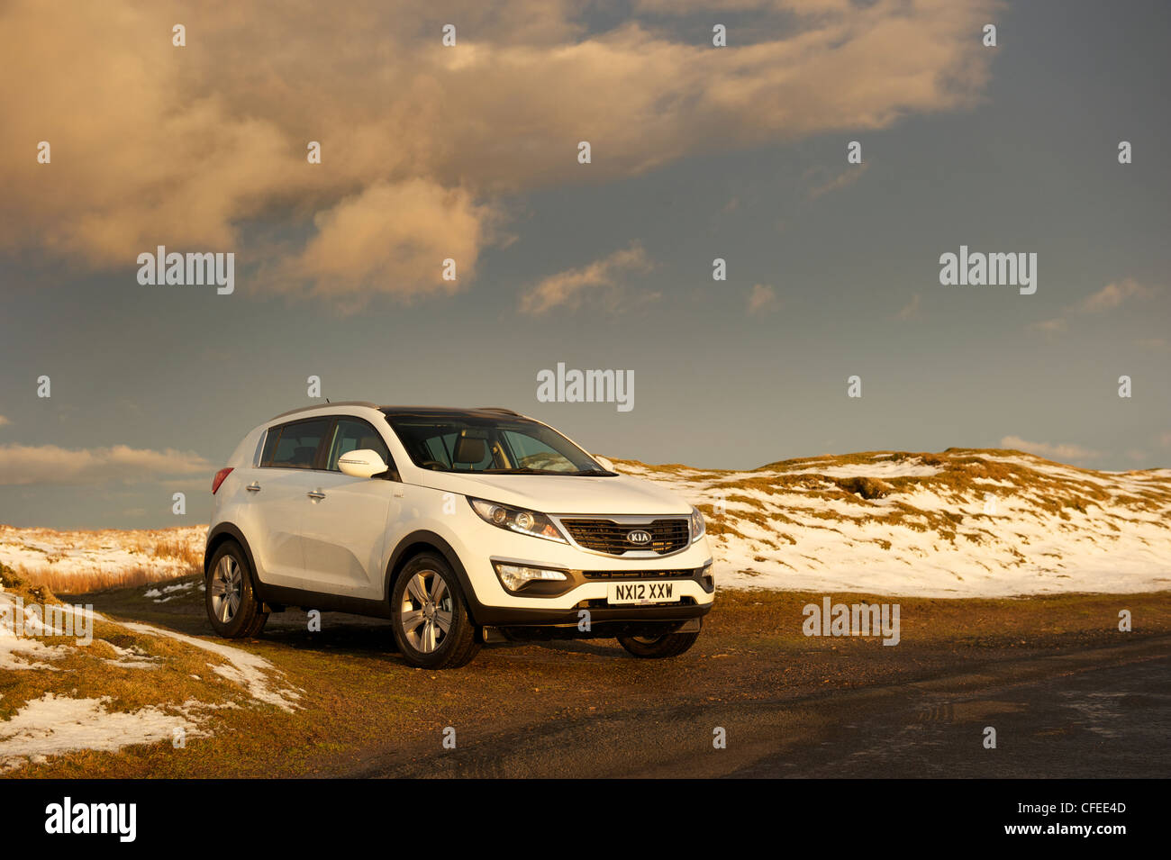 White KIA sportage in the snow Stock Photo Alamy