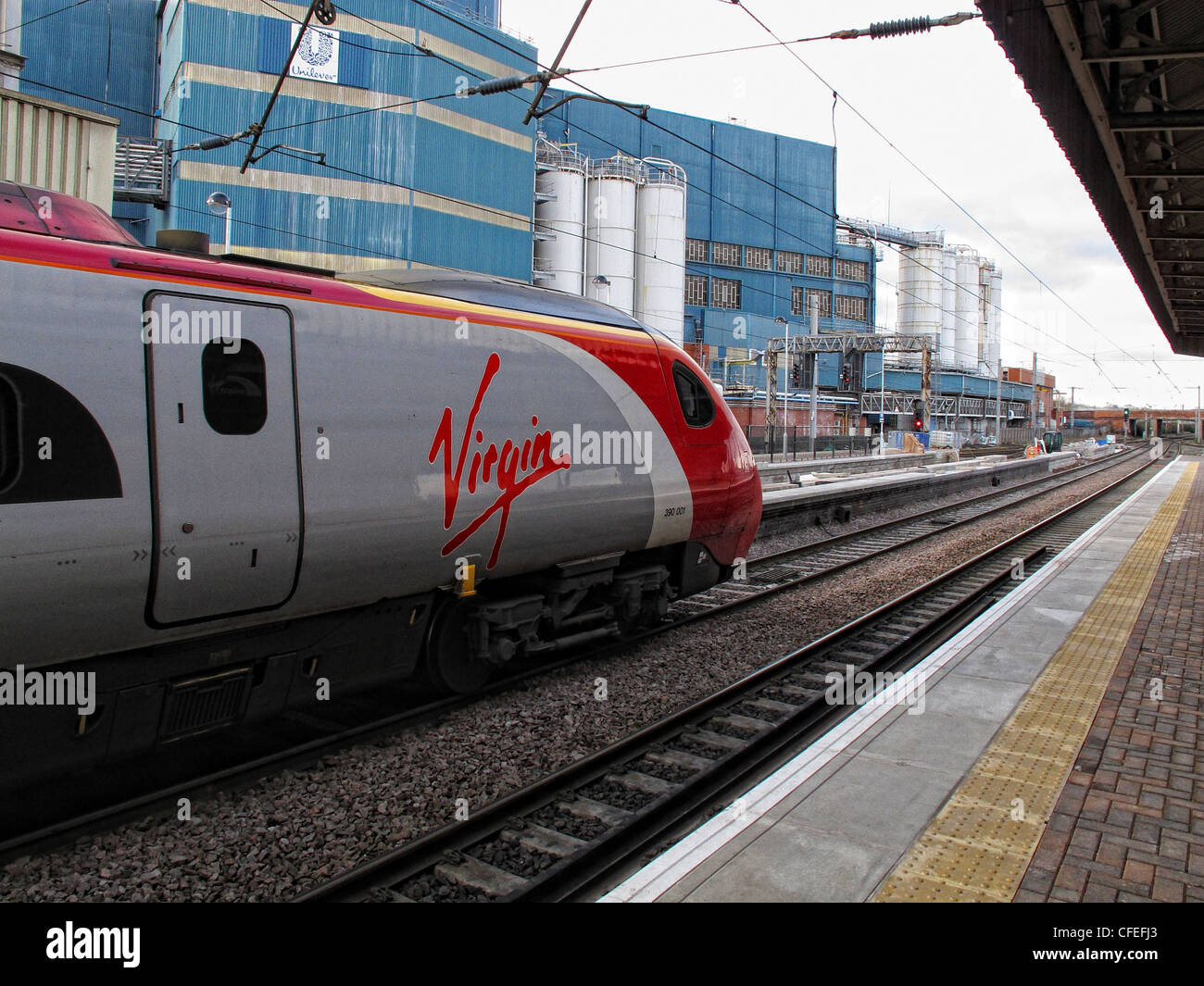 Virgin Pendo Pendolino train standing at platform three, Warrington Bank Quay railway station, Parker St, Warrington, Cheshire Stock Photo