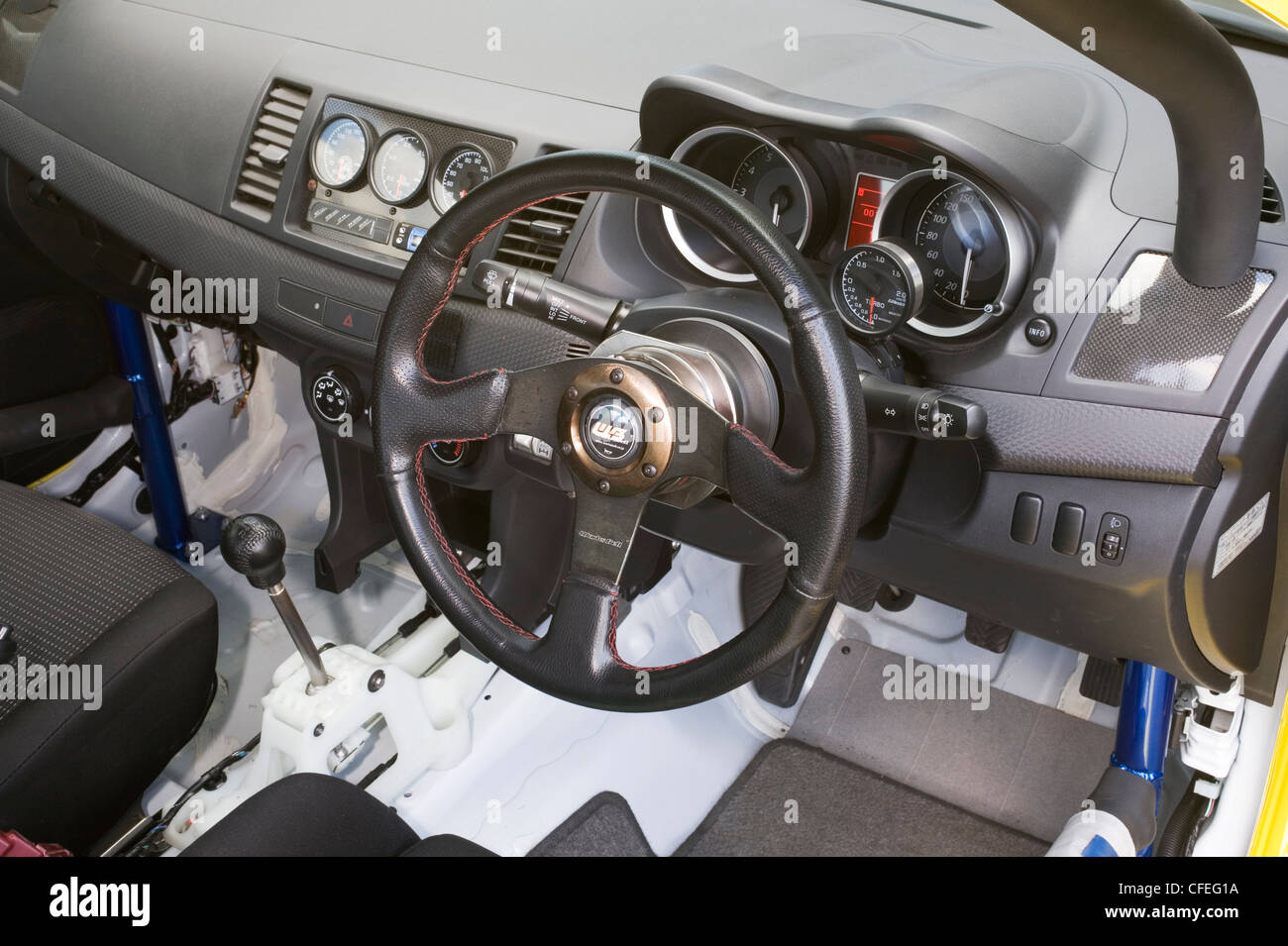 Steering wheel and dash dashboard area with speedo speedometer and