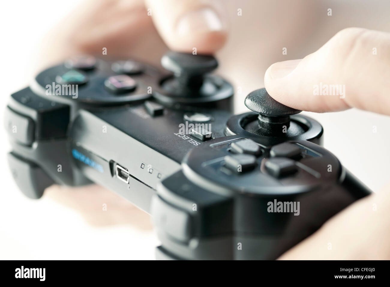 Male hands holding video game controller closeup Stock Photo