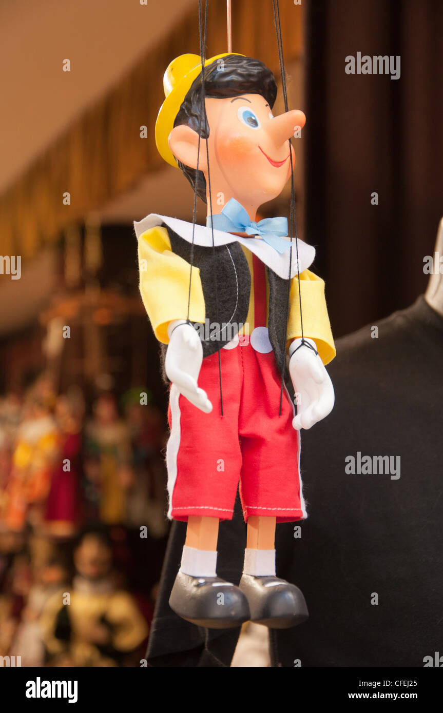 Puppet hanging from strings outside shop in Prague Stock Photo Alamy