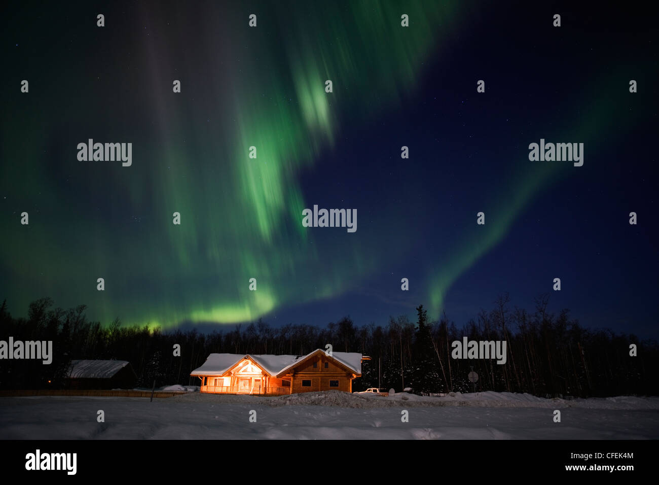 Strong northern lights display over alaskan residence in March 2012 Stock Photo