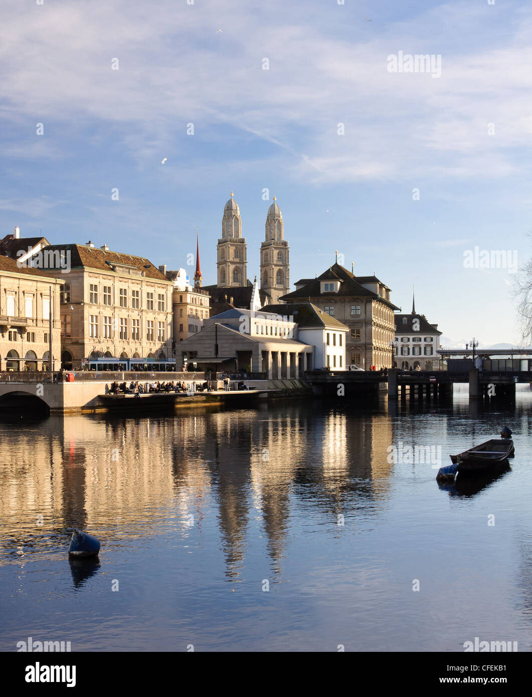 View of the Zurich historical city center reflecting into the river Limmat Stock Photo