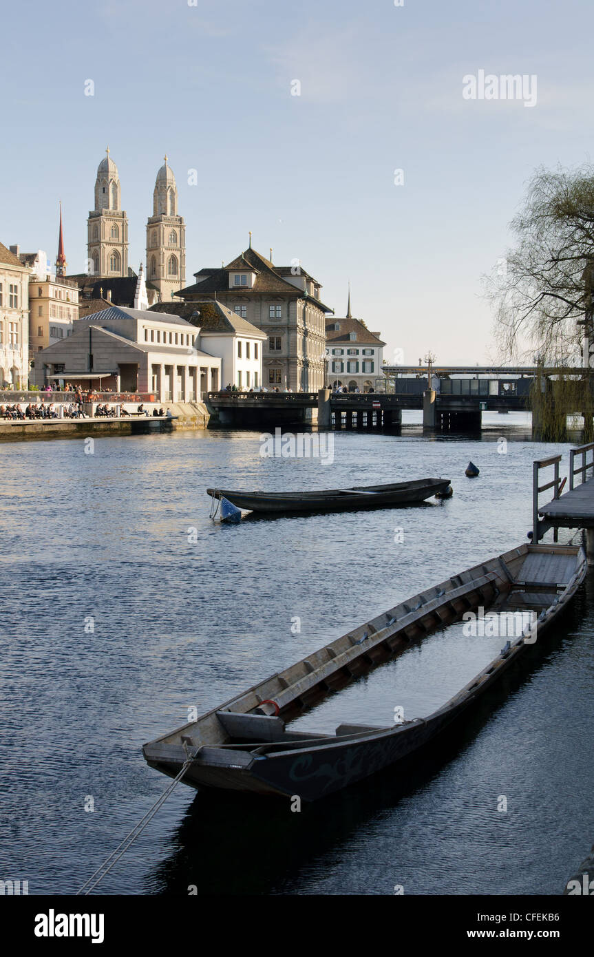 Boats on the river Limmat and Zurich old city center Stock Photo
