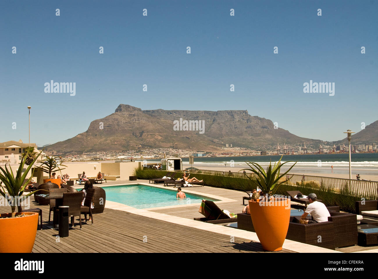 Table Mountain and Cape Town as seen from the pool deck at The Dolphin Beach Hotel, Milnerton. Stock Photo
