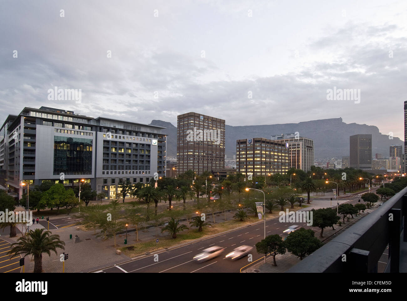 The Heerengracht, Adderley Street, high rise buildings and Table Mountain in Cape Town CBD South Africa, photographed at dusk Stock Photo