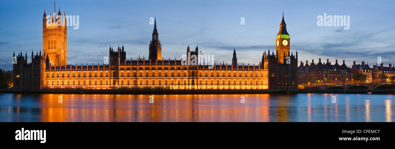 House of Parliament illuminated at dusk beside the river Thames, London, UK Stock Photo