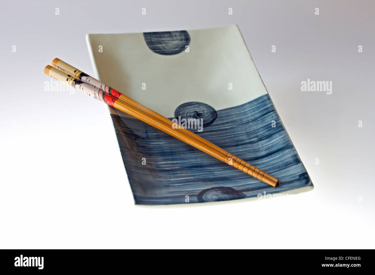 Japanese serving dish with chopsticks Stock Photo Alamy
