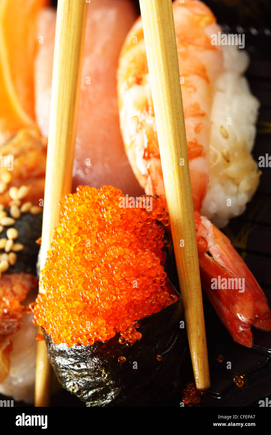 Traditional japanese sushi closeup and chopsticks Stock Photo Alamy