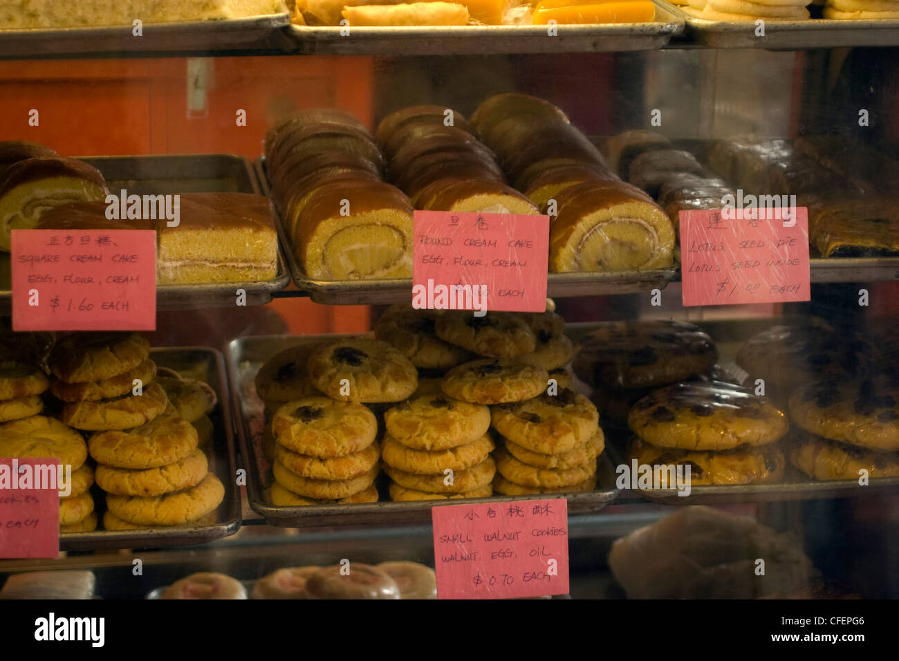 Chinese pastries are displayed in a case of a Chinese bakery shop in