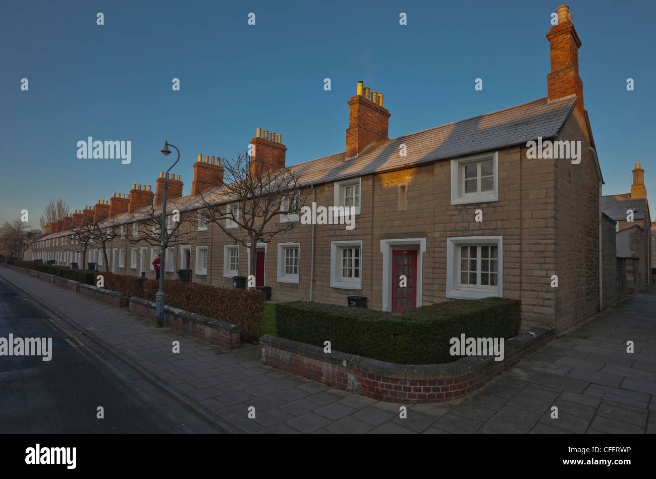 Row of terraced stone Almshouses, central Swindon, Wiltshire Stock Photo