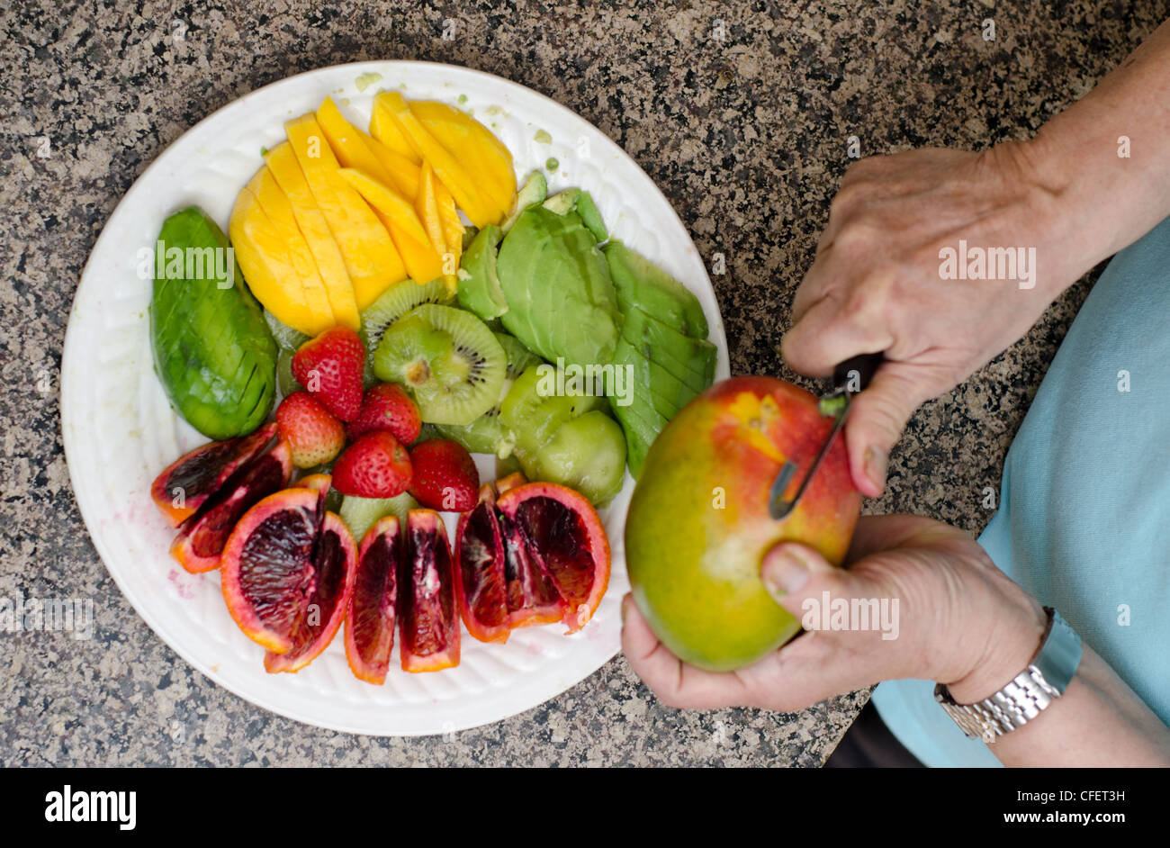 Woman mango peeling hi-res stock photography and images - Alamy