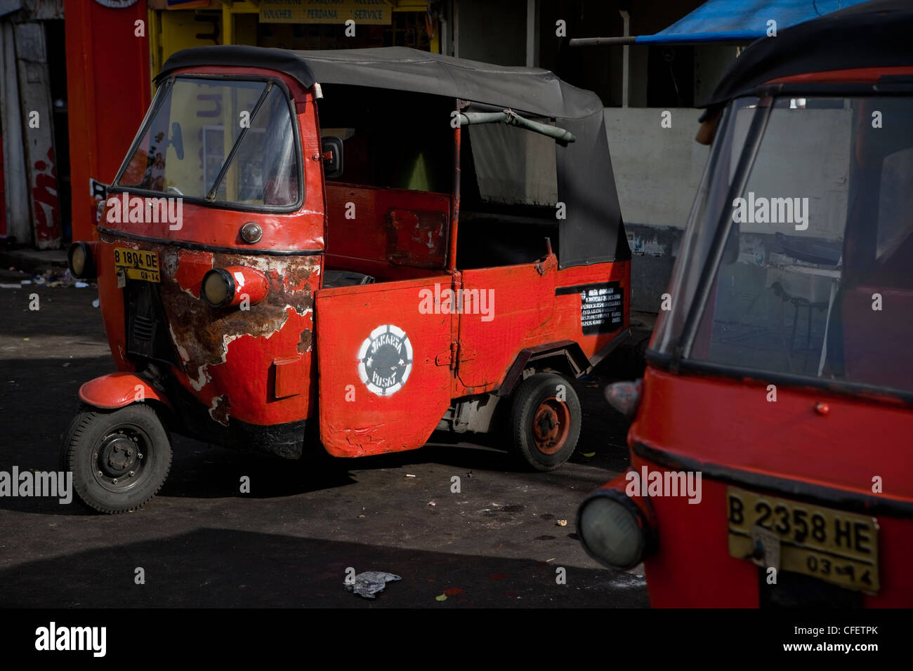 Bajaj three wheeled motor scooter parked in the city of Jakarta in Java, South Pacific, Indonesia, Southeast Asia, Asia. Stock Photo